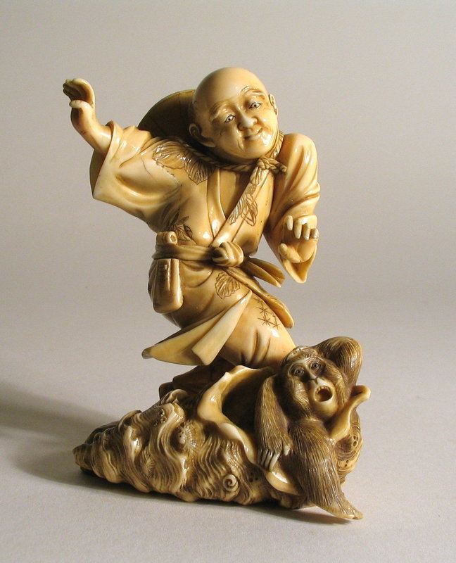 DESCRIPTION: A well carved Japanese ivory sculpture (or okimono) depicting a fisherman who finds a large shell on the beach.  To his surprise, a startled monkey emerges from the shell rather than a mollusk! The carving is of high-quality, illustrated by the fisherman’s movement, detailed straw hat and decorated robe, held together with a sash from which a tobacco pouch hangs.  Meiji Period, 1868 – 1912 and artist signed on the base of the shell. Very good condition with minor superficial age fissures.  DIMENSIONS:  4 ½” high (11.5 cm) x 3 ¼” wide (8.3 cm). <div id='rater_target1091447'></div>
