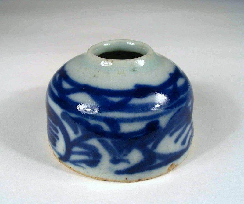 DESCRIPTION:  A good scholar’s water coupe (or brush washer) with blue underglaze floral patterns in loose brushstrokes.  Placed on the Chinese scholar’s desk, such coupes would hold water for rinsing brushes while the scholar worked on paintings or calligraphy.  Good condition, small abrasions to base rim, 18th century Qing Dynasty.  DIMENSIONS:  2 3/8” diameter (6 cm) x 1 ½” high (4 cm). <div id='rater_target1267610'></div>
