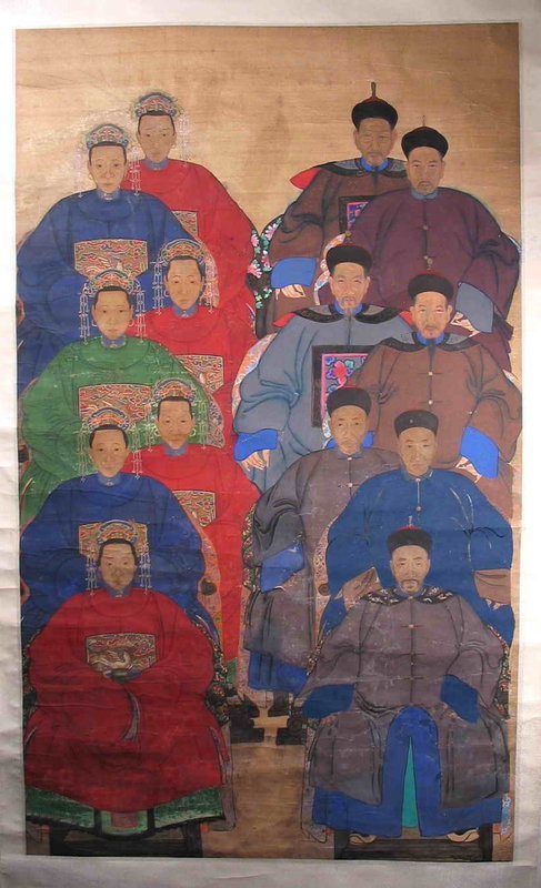 DESCRIPTION:  A large, boldly colored Chinese ancestor portrait featuring seven generations of mandarins and their wives.  Such paintings were commissioned by descendants, and this one is executed in classic ancestral portrait style with the unsmiling subjects facing directly forward and seated on chairs with rounded backs, the men with hands and shoes showing and the women with their robes completely covering hands and feet.
<p>A mandarin was a highly educated civil official who had passed a series of rigorous examinations to attain his post.  Not only was a mandarin knowledgeable in the duties of his office but he was also accomplished in the arts of music, poetry, calligraphy, and painting. In this painting, several of the men display their long, pointed fingernails, reminding the viewer that their occupation was intellectual rather than physical, and their elaborate robes identify their standing as scholars and government officials.  Likewise, the women’s heads are adorned with elaborate embroidered caps and dangling pearl ornaments.
<p>CONDITION: Probably dating from the early to mid 19th C., this colored ink on rice paper scroll has been remounted; the top 2/3’s area is in good condition, the bottom third has touchups and light wrinkling.  DIMENSIONS: Painting: 59” high (1.5 m) x 35” wide (89 cm); Whole Scroll: 80 1/2” high (2.05 m) x 38 ½” wide (97.8 cm).
<p>HISTORICAL BACKGROUND: Confucian teachings dictated the importance of honoring one’s ancestors. After someone's death, the family of the deceased often commissioned an ancestor portrait conveying the accomplishments and status of the ancestor in Chinese society.  These were then displayed at a family shrine or altar within the home where descendants burned incense, placed food offerings, and kowtowed to the image. Veneration of ancestors, an important part of Chinese life, centered on such portraits and were believed to facilitate the family's ability to communicate with the spirits of their predecessors.  All ancestors were painted with virtually the same expression - a symbolically somber and detached look- to suggest otherworldly status. Yet great care is taken in the portraits to record the deceased’s face realistically; capturing the likeness was crucial for the portrait to be able to function as a ritual object. It was said that if even one hair in the depiction was "wrong," all future prayers would go to someone else’s ancestor, resulting in family tragedy. The power of the living person was believed to reside in their portrait after death. 
<p>Most of the ancestor portraits that have survived depict members of the Qing imperial families or military and civil elite who ruled China from 1644 until the revolution of 1911.  These bold, almost graphic-art quality paintings, are much in demand today making stunning focal points in interiors ranging from traditional to very contemporary. 
<div id='rater_target1288442'></div>
