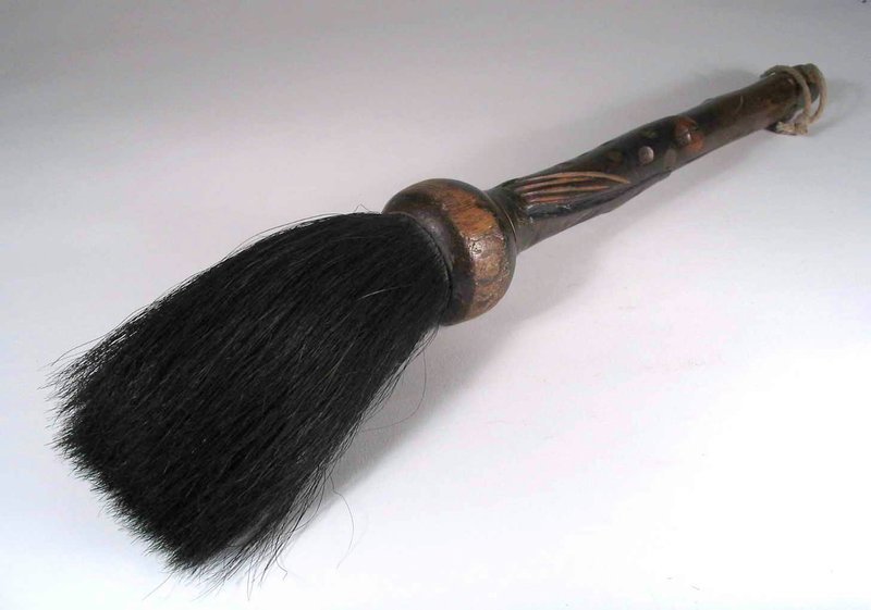 DESCRIPTION:  A large Qing Dynasty artist’s calligraphy brush fashioned from wood and carved in a naturalistic design.  The long black bristles are attached to a bulbous ferrule with the handle carved in a design reminiscent of bamboo leaves. This is a substantial, sturdy brush that shows usage wear and minor splitting on the handle.  DIMENSIONS:  17 ¼” long (43.8 cm).  <div id='rater_target1289367'></div>
