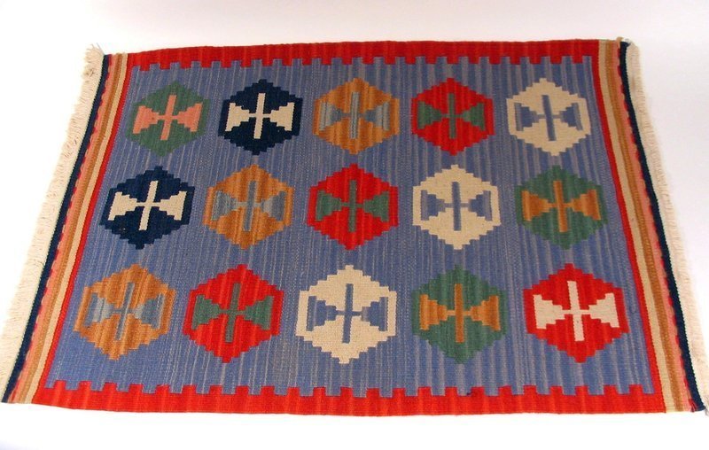 DESCRIPTION:  A colorful hand woven rug with red borders and hexagonal designs on a light blue ground.  This flat weave rug is reversible and is in excellent condition (bright colors, thick pile, no stains or losses).  After purchase, all of our textiles are professionally cleaned and stored until sold.  Sourced in Chile while on a buying trip, this rug would make an attractive area rug or wall hanging.  DIMENSIONS:  37.5" long (95.2 cm) x 25.25" wide (64 cm). <div id='rater_target1291074'></div>
