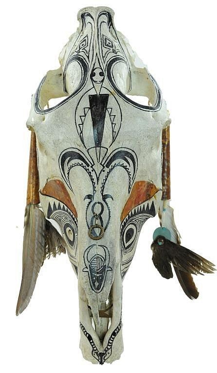 DESCRIPTION:  A hand painted and artist signed steer skull with copper accents.  The white steer skull is hand painted with Native American designs and incorporates ornamental attachments including copper plates over the eye sockets, an attached copper ring at the top of the skull, and hanging ornaments of leather strips, copper tubing and feathers.  Signed and dated by artist Pat Schwartz, 1985, and titled "Flight Skull."  Good condition and a perfect Southwestern accent piece.  DIMENSIONS: 26 3/4" long (68 cm) x 10 1/2" wide (26.7 cm). <div id='rater_target1299702'></div>
