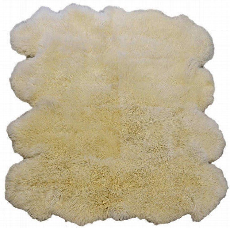 DESCRIPTION:  A white, luxurious, deep-pile llama fur rug with a white hide-leather back.  This is the kind of wonderful fur rug you love to walk on (or lay in) during a cold winter's evening.  Excellent condition with no fur loss, this rug is very soft to the touch, and would be a plush addition to the back of a sofa, or on a bedroom or lodge floor.  It is in such good condition that we are keeping it clean and wrapped in plastic until it finds its new owner.  DIMENSIONS:  This is a large rug, approximately 82" x 68"; total weight is 17 lbs.  <div id='rater_target1304982'></div>
