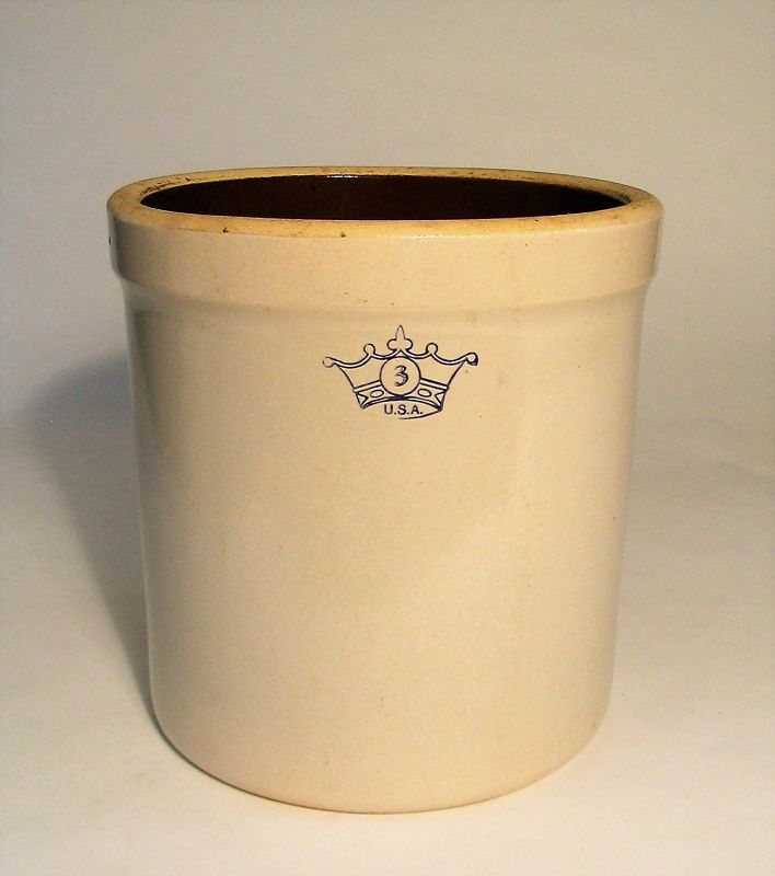 DESCRIPTION: A three gallon Roseville stoneware crock with an off-white exterior glaze and dark brown interior.  The bottom is inscribed:  “3 gal., R.R. P. Co., Roseville, Ohio, USA.”  These larger crocks are perfect for your antique kitchen implements such as rolling pins, large wooden spoons, etc.  Excellent condition, no chips. DIMENSIONS:   11” high x 11” diameter.
<div id='rater_target1368668'></div>
