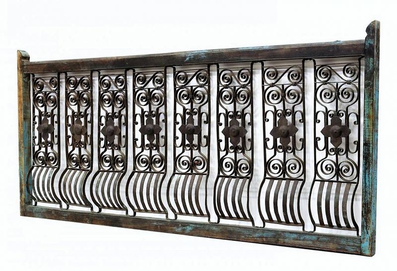 DESCRIPTION:  A section of an antique Dutch Colonial architectural terrace railing, consisting of a sturdy wood frame with worn blue paint, enclosing eight hand-forged iron panels with large center medallions surrounded by iron scroll work, the lower rails bowed out making a lovely design.  Would be a stunning decorative accent in the home, the garden, or if used as a striking king-sized headboard.  DIMENSIONS:  82"wide x 38” high.
<div id='rater_target1373239'></div>
