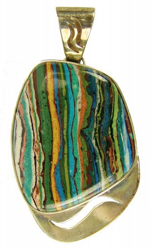 DESCRIPTION: Late 1900s, a fine sterling pendant with a cut-out flourish on the pendant plate and with a large, colorful calsilica stone, also called "rainbow calsilica," this one reflecting the painted colors of a Southwestern mountain desert at sunset. Very good condition, marked "DTR" (Desert Rose Trading, NM), ".925" (indicating sterling silver).  DIMENSIONS: Pendant is 2-1/2" long.
<div id='rater_target1374953'></div>

