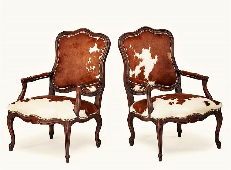 Pair<br /><br />
DESCRIPTION: Pair of Old Hickory Tannery French Louis XV style walnut armchairs upholstered in brown and white cowhide with brass tacks. Upholstery labels intact, excellent condition.  DIMENSIONS: 41" high x 27" wide x 27" deep.
<div id='rater_target1375620'></div>
