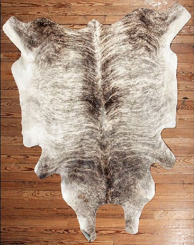 DESCRIPTION:  A cowhide rug with thick white and grey-brown hair, beautiful for either a country, western or lodge interior.  Excellent condition. DIMENSIONS: 71" x 85"
<div id='rater_target1376307'></div>
