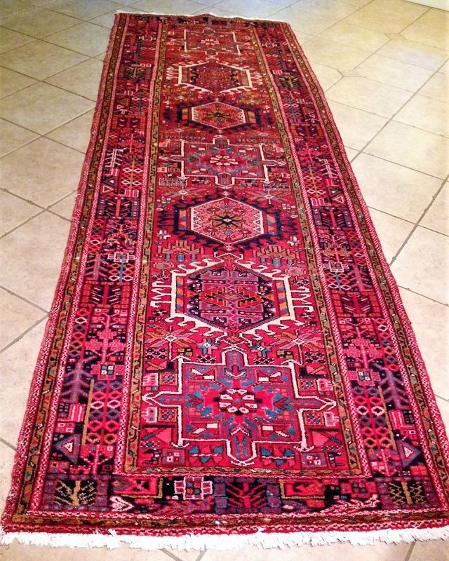 DESCRIPTION:  A semi-antique wool Karaja runner with very good color, mostly in red with teal blue, white & black accents. Seven central medallions (a characteristic of Karaja rugs) are surrounded with a wide border having intricate designs. Karaja is the home of some of the finest runners made in Iran of which this is a good example. This hand-knotted carpet is in good condition with ample pile that will give years of service.  DIMENSIONS: 3'9” wide x 11'6” long.
<div id='rater_target1390351'></div>
