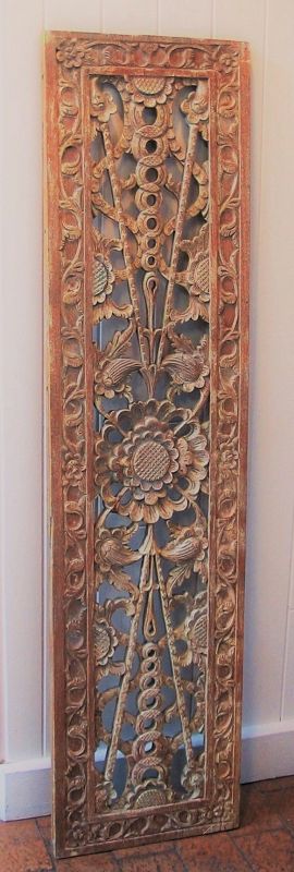 DESCRIPTION:  A beautifully carved antique wood panel from Southeast Asia, carved with a large center flower medallion surrounded by leafy tendrils within a flower and vine outer border.  The panel has an almost whitewashed appearance due to a lightly painted old surface.  Very good condition with no warping; hanger on the back to hang horizontally.  DIMENSIONS:  45” long x 11 3/8” wide x 7/8” thick.
<div id='rater_target1393083'></div>
