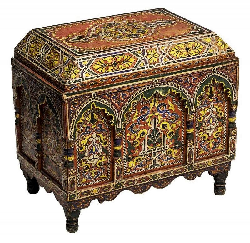 DESCRIPTION:  An exotic and intricately painted polychrome lidded wood chest of Italian Arabesque design. The body is decorated with carved architectural form arches and columns on three sides with intricately painted geometric and floral designs on a red ground.  The back is also painted and has a large center pomegranate medallion with floral designs. Rising on turned feet, a scalloped apron forms the base; the hinged lid conceals open storage. Some paint loss and separation to wood. DIMENSIONS: 20.5" high, 22" wide x 14" deep.


<div id='rater_target1397628'></div>
