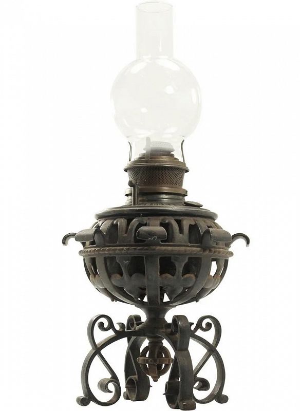 DESCRIPTION:  An ornate, cast iron oil lamp by Bradley & Hubbard in gothic style with a pierced, rounded body and vine & tendril feet.  Beautiful iron work, original font, bulbous glass shade; stamped B&H for Bradley & Hubbard. Very sturdy and in excellent condition. DIMENSIONS: Lamp is 13”H x 9”W; Shade is 9”H x 5”W.<div id='rater_target1472156'></div>
