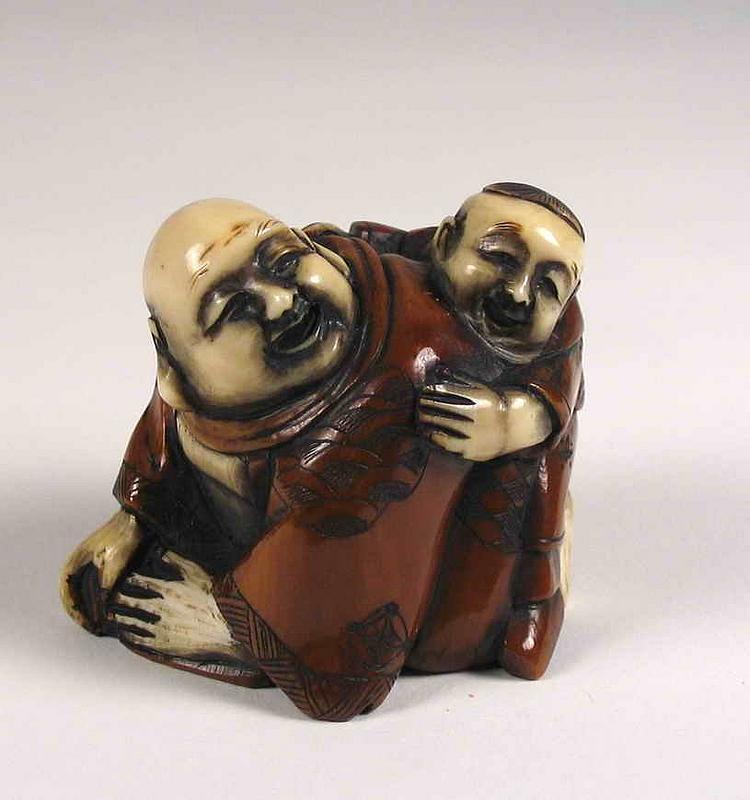 DESCRIPTION:  A charming ivory netsuke featuring a young boy clambering upon the back of a robed man (perhaps Hotei) with bald head and pendulous ear lobes.  The two figures have been depicted with wonderfully expressive smiling faces.  Their clothing has been stained a rich brown, and the hands and faces left natural ivory.  From a private collection, and signed by the artist on the base.  DIMENSIONS: 1 3/4” high x 1 7/8” wide x 1 3/8” deep. 
<div id='rater_target388383'></div>
