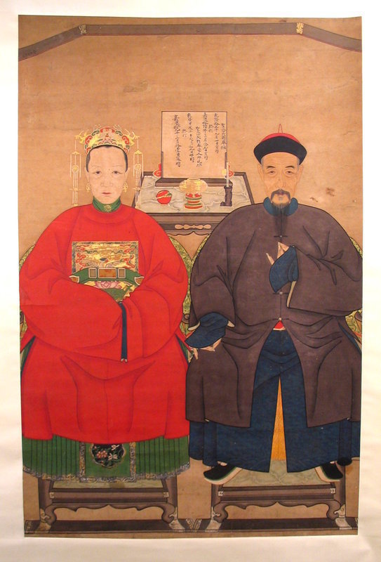 DESCRIPTION:  Nearly life-sized and in the traditional frontal pose, this painting on rice paper depicts a Chinese Qing official (mandarin) and his wife seated on elaborately carved chairs in semiformal gowns.  The woman's bright red robe has an embroidered insignia that proclaims the couple's rank and status.  Her feet and hands are hidden and she wears an elaborate headdress of gold and pearls. Wearing an eggplant colored overcoat, the husband sits in his official hat while stroking his beard with long fingernails. The detail is quite excellent on their faces and garments. On a table between the couple is a plaque indicating the ancestral lineage and position of the persons depicted. We believe this painting dates to the 19th century, possibly earlier, and has been skillfully remounted.  It has a few minor stains and retouched areas, but the colors are quite vibrant and overall it provides a striking appearance.  DIMENSIONS:   Painting is 34" wide (86.4 cm) x 52 1/2" high (1.33 m); scroll is 40" wide (1.02 m) x 83 1/2" high (2.12 m). 

<P>ABOUT ANCESTOR PORTRAITS: The Chinese have long had a profound connection to their ancestors. They believe that death doesn't end a person’s relationship with the living, and that, if properly worshipped in private family rituals, the spirits of their ancestors will bring them health, long life, prosperity and children.  In Imperial China, filial sons, as part of their family duty to care for the spirits of their ancestors, paid homage to them in ritual ceremonies, placing food offerings before the portraits of their forebears. Chinese commemorative portraits were painted specifically for use in ancestor worship. Besides being compelling art, the paintings reveal much about Chinese social and cultural history.  With the development of photography in the 19th century, the painting of ancestor portraits began to wane.

<div id='rater_target1213176'></div>

