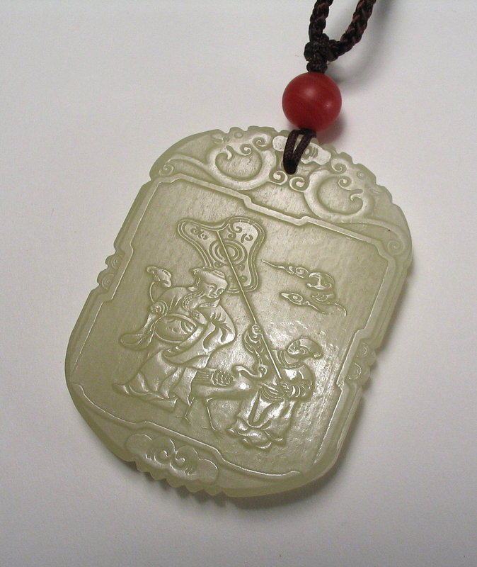 DESCRIPTION: A finely carved celadon nephrite jade plaque, one side depicting a child attendant with crane holding a large fan over the head of an immortal. Three lines of raised calligraphy are on the reverse.  Excellent condition, late 19th or early 20th century, Qing Dynasty.  DIMENSIONS:  2" long (5 cm) x 1 3/4" wide (7 cm).  <div id='rater_target1267143'></div>
