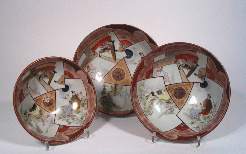 for all three<br /><br />
DESCRIPTION: A lovely graduated set of Japanese Kutani porcelain bowls, each delicately hand painted with three overlapping rectangular cartouches which reveal landscape, garden and interior scenes, highlighted with raised gilt decoration.  Each bowl is signed on the base, Kutani Sei.  The mark and style of this set dates it to the end of Meiji period (1868-1912), from around 1910-20.  All bowls are in excellent condition, no chips or restorations. 
<p>DIMENSIONS:  All three bowls nest neatly.  Largest Bowl, 9 3/8” diameter (24 cm) x 3 ¼” H (8.3 cm);  Medium Bowl, 8 ¼” diameter (21 cm);  Smallest Bowl, 7 ¼” diameter (18.5 cm).
<div id='rater_target1282944'></div>
