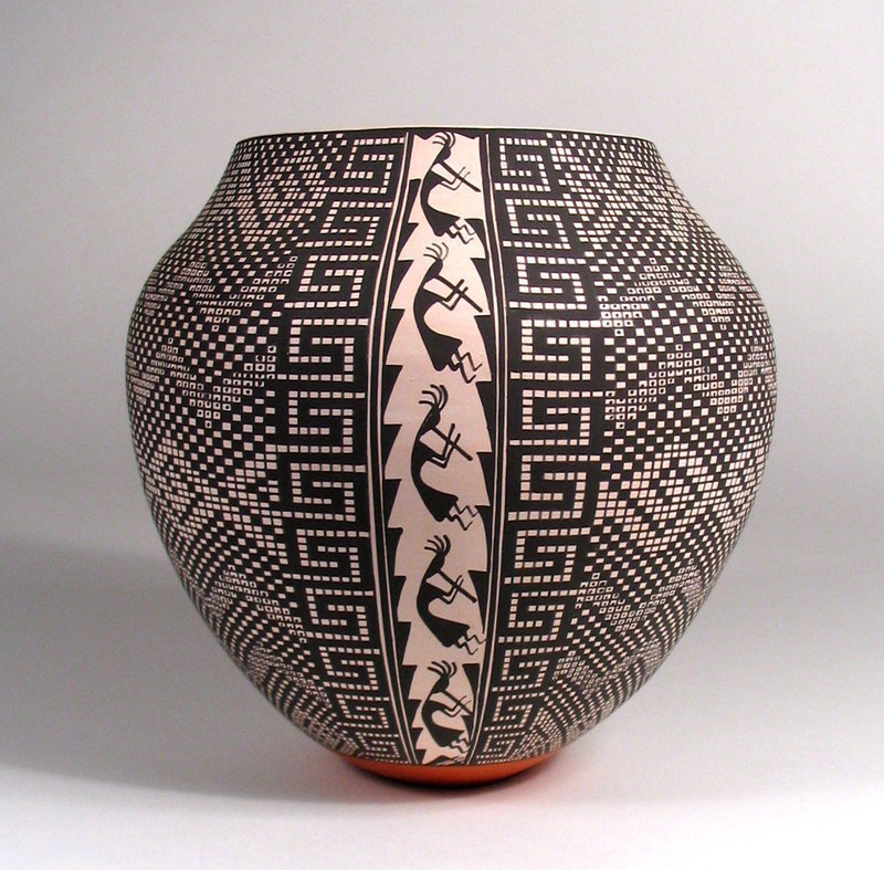 DESCRIPTION:  Some of the most spectacular Acoma pottery pieces are the geometric designs rendered in black on white.  This thin-walled, hand coiled olla represents the pinnacle of this category with exceptionally small squares, both white and black, forming intricate mazes across the entire surface signifying rain and lightning bolts.  The pot is narrow at the base and gradually widens to the broadest section just before the taper towards the mouth. In a bold stripe from top to bottom, Kokopelli figures (ancient Southwestern Native American fertility deities) play their flutes.  The Acoma potter, Melissa Concho Antonio, has masterfully executed a complicated design that requires absolute concentration and precision to apply - and that being done with a paint brush fashioned from the leaf of a yucca plant.  It is this willingness to apply difficult designs that distinguish the best Acoma painters.  Excellent condition; dating from the last quarter of the 20th C.  DIMENSIONS:  7" high (17.8 cm) x 7.25" diameter (18.4cm).  
<p>ABOUT THE ARTIST: This visually stunning piece of hand-coiled and painted Acoma pottery was made by award-winning potter, Melissa Concho Antonio (b. 1965), and is a testament of her fine-line painting abilities.  Her designs are extremely time-consuming and involve precise calculations and planning.  Melissa is of the Acoma Pueblo Red Corn and Sun Clans and has been an active potter since the 1980s.  She works with traditional and slip cast polychrome jars, bowls and vases, and is best known for her intricate black on white geometric designs. Her teachers were award winning pottery artists Lilie Concho (her mother) and Mildred Antonio (her mother-in-law), who taught her the traditions of Acoma pottery, from gathering the clay and coiling the pots, to making natural pigments and creating incredibly fine lined designs. Melissa will occasionally accent her pottery by adding a Kokopelli band down the side (as in this example). 
<p>Melissa Antonio has won numerous 1st, 2nd and 3rd place awards at the Santa Fe Indian Market, the New Mexico State Fair, the Eight Northern Pueblos Arts & Crafts Show, and the Inter-Tribal Ceremonial. She is well known for her creative, perfectly executed graphics. Her traditional, hand coiled pottery is widely collected and included in many known collections.  Melissa's work and achievements are highlighted in Dr. Gregory Schaaf’s book “Southern Pueblo Pottery: 2000 Artist Biographies;” Berger and Schiffer’s “Pueblo & Navajo Contemporary Pottery;” and Rich Dillingham’s “Fourteen Families in Pueblo Pottery.”
<p>ABOUT ACOMA POTTERY:  Thin, hand fired walls (a common and sought after characteristic of Acoma pottery), light weight, and geometric designs characterize Acoma pottery.  The Acoma Pueblo, also known as "Sky City," is located 50 miles west of Albuquerque near Enchanted Mesa, and is one of the oldest continually inhabited sites in North America. The area is home to particularly good clay, which potters mix with a temper of crushed potsherds. This results in the ability to produce very thin and lightweight, yet strong pottery. 
<P>Traditional designs range from complex geometrics to abstract animal, floral and figurative forms. Coloration consists predominantly of black and white, or black, white and orange although other colors also appear infrequently. Acoma clay is grey in color and potters achieve their white surface with a slip of kaolin, a naturally occurring chalky material that is a brilliant white. Black is made from crushed iron-rich hematite and/or the liquid from boiled wild spinach, which are often mixed together.  There are no schools or universities that teach the complex techniques and skills necessary to make Native American Acoma Pottery. It takes many years to learn, requires much dedication and sacrifice, and is a skill passed down by the elders from generation to generation. 
<div id='rater_target1303145'></div>
