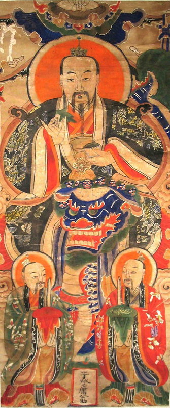 DESCRIPTION:  A Qing Dynasty Chinese scroll painting depicting a seated Chinese deity with a large blue foo dog mask in his lap and two attendants at his feet. All figures have ornate colorful robes and auroras around their heads.  An inscription can be found at the lower middle between the two attendants.   CONDITION: “Waves” in paper from being rolled; colors and images are bright; painting has been remounted on white paper-backed silk. DIMENSIONS:  Image is 47 3/4” high (1.21 m) X 20 1/2” wide (52 cm).  Entire scroll:  67 1/2” high (1.71 m) X 251/4” wide (64 cm). <div id='rater_target1303365'></div>
