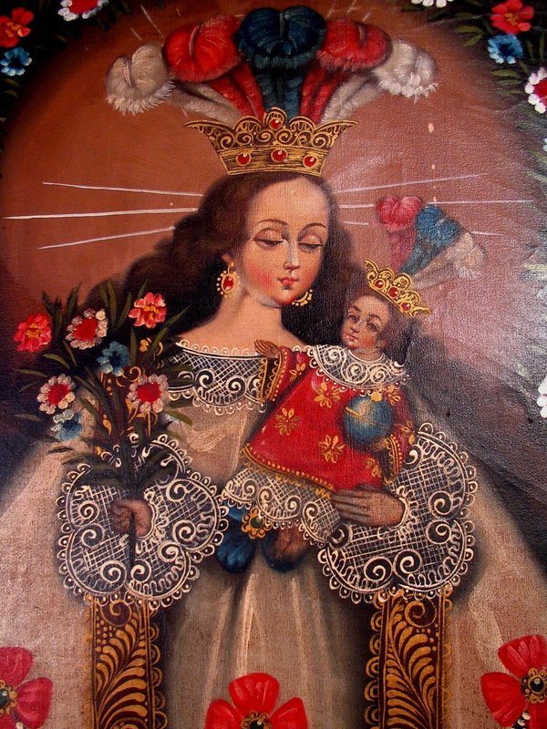 DESCRIPTION:  A large Cuzco School oil on canvas depicting “Our Lady of Pomata,” who is said to protect the town of Pomata, Peru. Pomata is situated above Lake Titicaca in the highlands of Peru, and was once a popular Christian pilgrimage shrine. In this painting the Virgin is depicted as cradling the Christ Child in her left arm and holding a bouquet of flowers in her right hand.  Both she and the child are adorned with bejeweled and feathered gold crowns and fine white lace which almost seems three dimensional.  Her long flowing gown has burgundy sashes embroidered in gold with large swags of pearls fastened with huge rosettes.  Pearls were a novel find by the Spanish in the New World, and became a symbol of purity. The Virgin stands as if on an altar whose gold trimmed drapery has been opened for worship. Two angels hold the drapery back, while St. Nicholas Tolentino and St. Rose of Lima appear at her feet, hands folded in prayer.  This painting is unsigned, is in good condition, and most likely dates to the late 19th or early 20th C.  DIMENSIONS:  Sight dimensions are 33.5" high (85 cm) x 24.5" wide (62.3 cm). In the frame 37.75" high (96 cm) x 28.75" wide (73 cm).
<p>THE CUZCO SCHOOL:  The Cuzco School (Escuela Cuzqueña) was a Roman Catholic artistic tradition based in Cusco, Peru (the former capital of the Inca Empire) during the Colonial period of the 16th, 17th and 18th centuries.  It is considered the first artistic center that systematically taught European artistic techniques in the Americas, and was the most distinctive major school of painting in Spain's American colonies. In the Colonial period, the Spanish sent a group of religious artists to Cusco, who then formed a school for Quechua and mestizos peoples, teaching them the techniques of drawing and oil painting. Soon, Cusco became the main art center in the Andes highlands.  Eventually it spread to other cities in the Andes, as well as to present day Bolivia, Ecuador and Mexico.  

<p>This Spanish colonial art flourished in the New World where the native artists developed distinctive regional styles by combining native subjects with European artistic traditions.  Native and mestizo artists transformed the formal and iconographical styles of European art to create a uniquely American style of religious painting.  Favorite subjects included biblical narratives, hieratic figures of the Virgin and saints, and elaborately dressed archangels. Cuzco School paintings are characterized by their lack of perspective (giving them a flattened spatial appearance) and the predominance of red, yellow and earth colors.  They are also remarkable for their lavish use of gold leaf overlay (brocateado de oro), a strong decorative aesthetic, and idealized landscapes that often include brightly colored tropical birds and flowers. 
<div id='rater_target1305162'></div>
