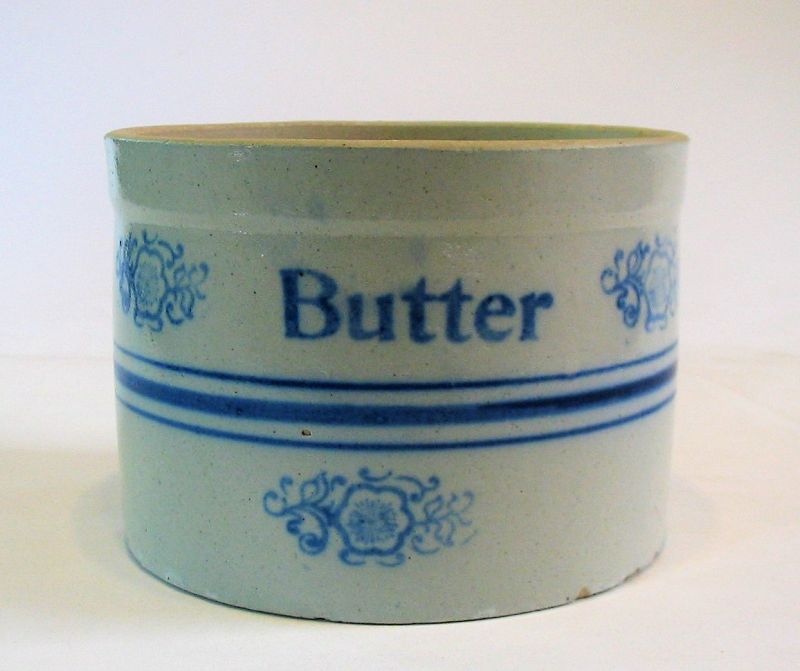 DESCRIPTION:  Antique American salt glazed stoneware crock with blue underglazed stripes, flowers, and “Butter” decorating the circumference.  A “must have” for the country kitchen to hold eggs or fruit, 19th C., unmarked. Good condition; minor nicks to bottom rim. DIMENSIONS:  5.25” high x 7.25’ diameter. 
<div id='rater_target1366454'></div>
