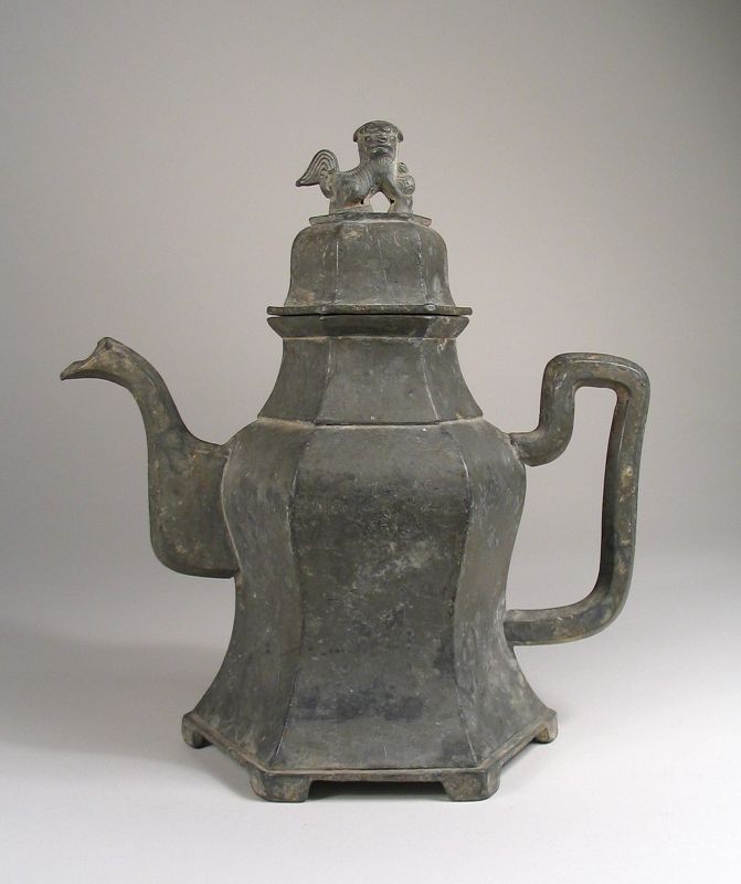 DESCRIPTION: A heavily cast, six-sided Chinese pewter teapot, the domed lid mounted with a foo dog and the base raised on six feet. Latter Qing Dynasty (19th C.) and in good condition with light usage wear. DIMENSIONS: 8 ¼” high (21 cm) x 7 ½” wide (19 cm).
<div id='rater_target1386366'></div>
