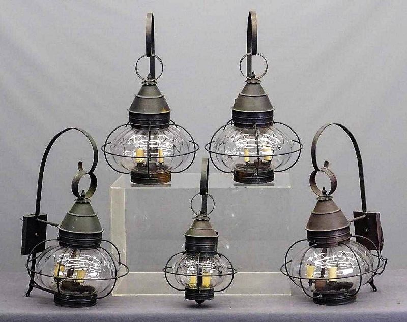 For all five<br /><br />
DESCRIPTION:  A wonderful set of vintage outdoor metal and glass ‘caged onion lamps.’  It’s rare to acquire a full set of vintage outdoor lighting in such good condition.  These lanterns are of a nice larger size with tall upper metal hooked hangars and with the original (and wonderfully squatty) large glass onion globes.  Contemporary reproductions of this traditional outdoor lamp tend to be smaller in size. This set comes from a New York estate, and would be an eye-catching addition to a lake house, farmhouse or country home’s exterior lighting.  CONDITION:  We make no claims regarding the viability of the wiring on these electrical lamps; they should be evaluated by a licensed electrician to determine working condition and safety; the wiring may need to be replaced.  DIMENSIONS:  Four of the lamps are 26" high, 16" x 16"; the smaller door lamp is 21" high, 13" x 10”.
A-MTL11   $1,200.00
<div id='rater_target1388271'></div>
